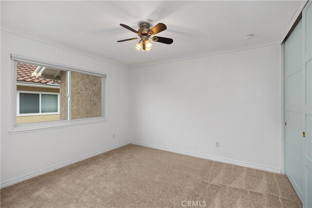 29162 Bobolink Dr, Laguna Niguel, CA 92677 - carpeted empty room featuring ornamental molding, ceiling fan, baseboards, and a smoke detector