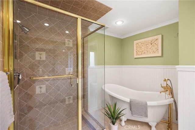29162 Bobolink Dr, Laguna Niguel, CA 92677 - full bath featuring a freestanding tub, a shower stall, crown molding, a wainscoted wall, and tile patterned floors