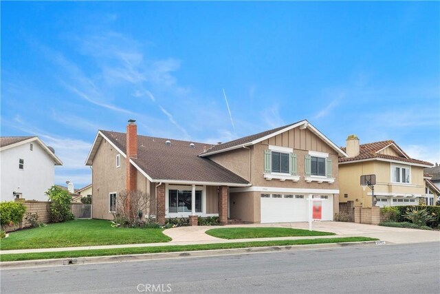 29162 Bobolink Dr, Laguna Niguel, CA 92677 - view of front of house with a garage, a chimney, driveway, and board and batten siding