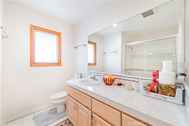 1855 Turnbull Canyon Rd, Hacienda Heights, CA 91745 - bathroom featuring toilet, a shower with shower door, vanity, tile patterned floors, and baseboards