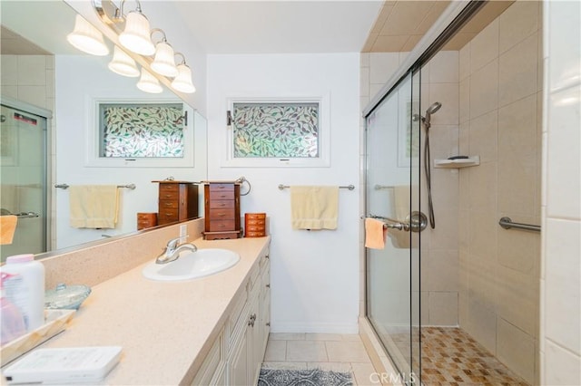 1855 Turnbull Canyon Rd, Hacienda Heights, CA 91745 - bathroom featuring double vanity, a stall shower, tile patterned flooring, and baseboards