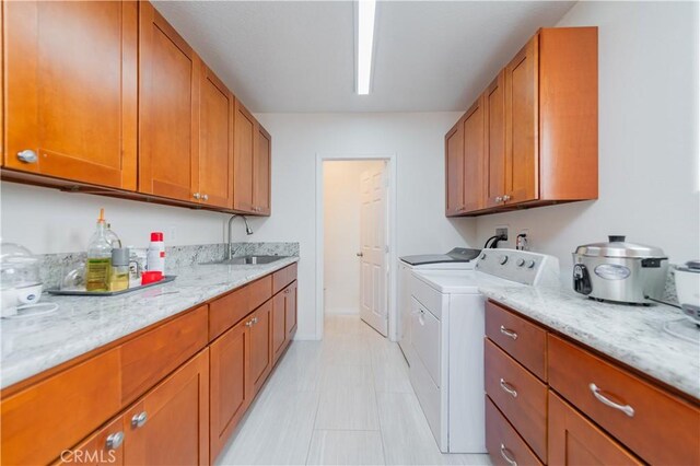 1855 Turnbull Canyon Rd, Hacienda Heights, CA 91745 - washroom featuring washer and clothes dryer and cabinet space