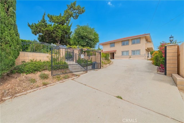 1855 Turnbull Canyon Rd, Hacienda Heights, CA 91745 - view of front of house with a gate and stucco siding