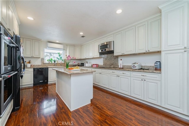 1855 Turnbull Canyon Rd, Hacienda Heights, CA 91745 - kitchen featuring black appliances, dark wood-style flooring, decorative backsplash, a wall mounted AC, and a center island