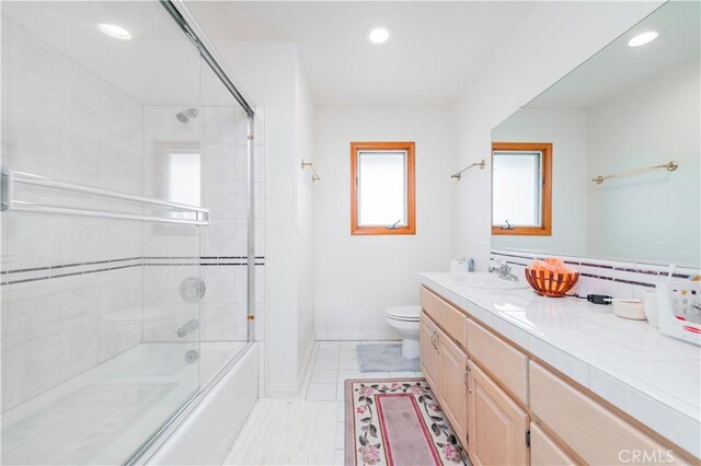 1855 Turnbull Canyon Rd, Hacienda Heights, CA 91745 - bathroom featuring vanity, toilet, shower / bath combination with glass door, recessed lighting, and baseboards