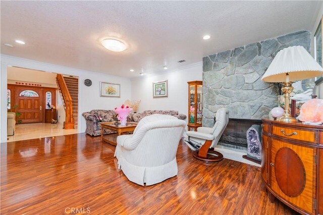 1855 Turnbull Canyon Rd, Hacienda Heights, CA 91745 - living room featuring ornamental molding, wood finished floors, a fireplace, and recessed lighting