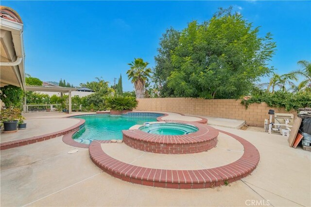 1855 Turnbull Canyon Rd, Hacienda Heights, CA 91745 - view of swimming pool with a patio, a fenced backyard, and a pool with connected hot tub