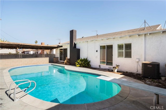 1131 Jarrow, Hacienda Heights, CA 91745 - view of swimming pool with cooling unit, a fenced backyard, and a diving board