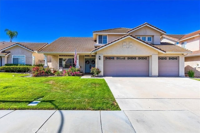32091 Camino Nunez, Temecula, CA 92592 - townhome / multi-family property with stucco siding, concrete driveway, a front lawn, a tiled roof, and a garage