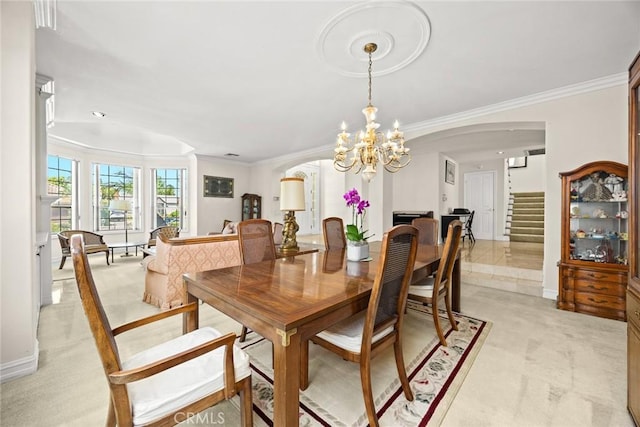 1526 S 2nd Ave, Arcadia, CA 91006 - dining space featuring arched walkways, crown molding, stairs, a chandelier, and light carpet
