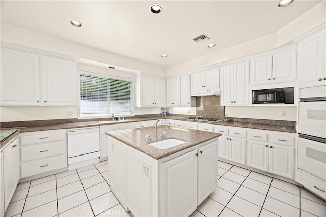 1526 S 2nd Ave, Arcadia, CA 91006 - kitchen featuring white appliances, white cabinets, light tile patterned floors, a center island with sink, and recessed lighting