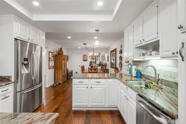 21778 Tahoe Ln, Lake Forest, CA 92630 - kitchen with appliances with stainless steel finishes, a sink, a peninsula, recessed lighting, and white cabinets