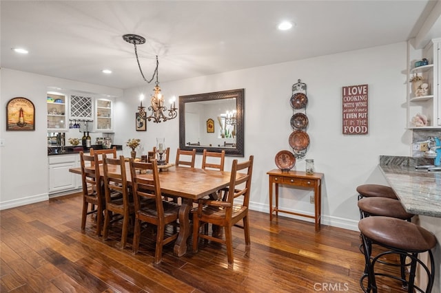 21778 Tahoe Ln, Lake Forest, CA 92630 - dining area featuring dark wood finished floors, bar, baseboards, recessed lighting, and a chandelier