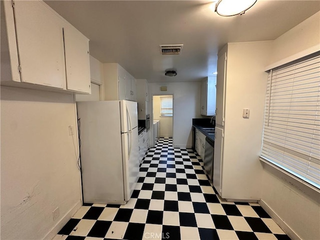 14655 Morrison St, Sherman Oaks, CA 91403 - kitchen with freestanding refrigerator, light flooring, white cabinetry, and dishwasher