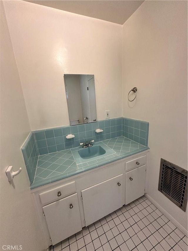 14655 Morrison St, Sherman Oaks, CA 91403 - bathroom with vanity, tile patterned floors, and backsplash