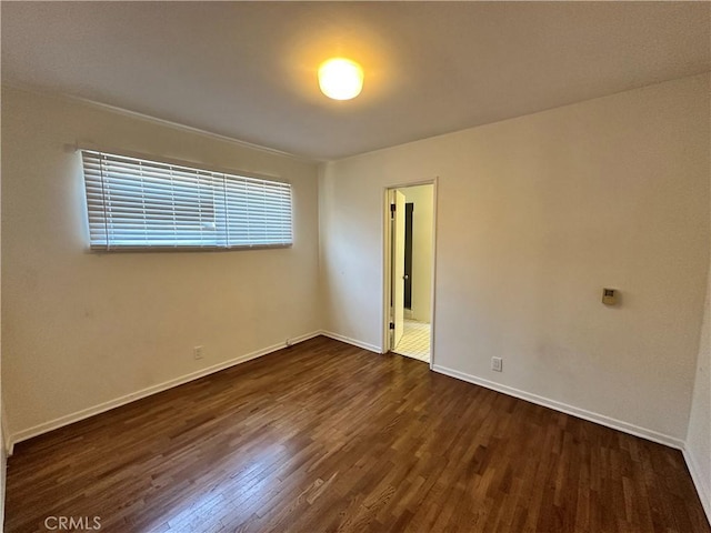 14655 Morrison St, Sherman Oaks, CA 91403 - unfurnished room featuring dark wood-style flooring and baseboards