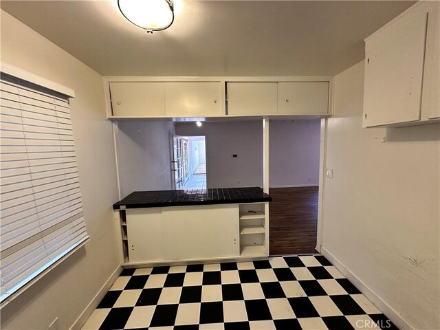 14655 Morrison St, Sherman Oaks, CA 91403 - kitchen featuring tile patterned floors and white cabinetry