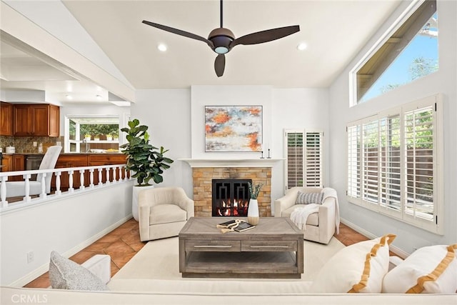 925 Calle Hermosa, San Dimas, CA 91773 - living room featuring lofted ceiling, a stone fireplace, ceiling fan, recessed lighting, and light tile patterned floors