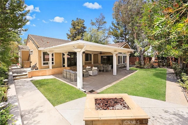 925 Calle Hermosa, San Dimas, CA 91773 - back of house featuring an outdoor living space with a fire pit, ceiling fan, a patio area, a tile roof, and stucco siding