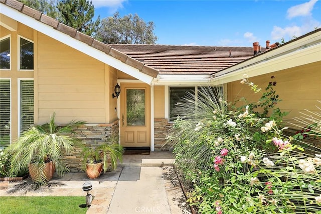 925 Calle Hermosa, San Dimas, CA 91773 - view of exterior entry with stone siding and a tile roof