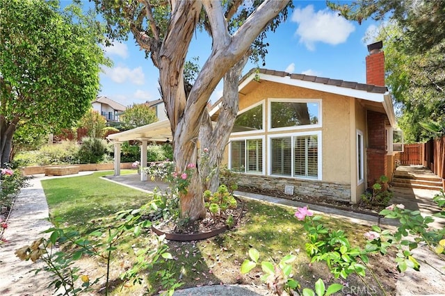 925 Calle Hermosa, San Dimas, CA 91773 - view of front facade featuring a chimney, stucco siding, stone siding, and a patio area