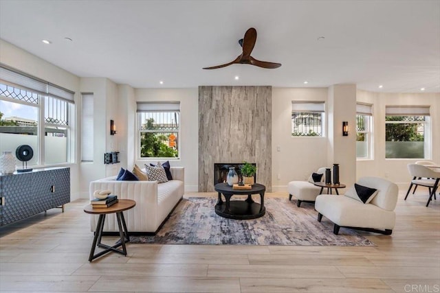 3285 5th Ave, San Diego, CA 92103 - living room featuring light wood-style floors, recessed lighting, a ceiling fan, baseboards, and a fireplace