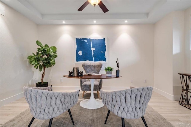 3285 5th Ave, San Diego, CA 92103 - living area featuring light wood finished floors, a tray ceiling, ceiling fan, and recessed lighting