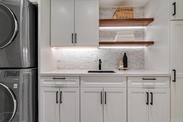 3285 5th Ave, San Diego, CA 92103 - laundry area with cabinet space and stacked washer / drying machine