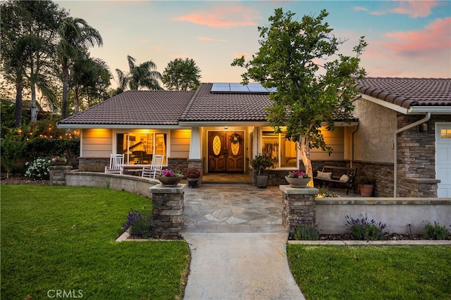 251 Miramar St, Upland, CA 91784 - view of front of property featuring stone siding, a porch, and a tile roof
