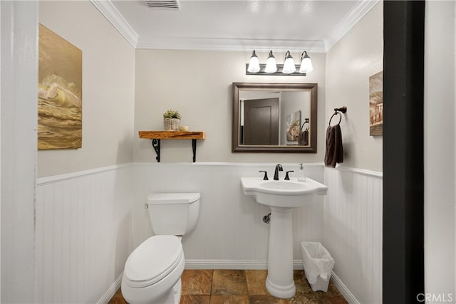 251 Miramar St, Upland, CA 91784 - half bathroom with toilet, ornamental molding, wainscoting, stone finish flooring, and a sink