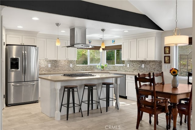 251 Miramar St, Upland, CA 91784 - kitchen with appliances with stainless steel finishes, island exhaust hood, white cabinets, lofted ceiling, and recessed lighting