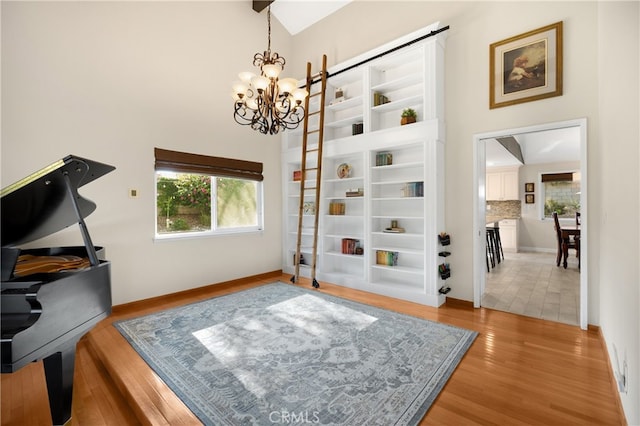 251 Miramar St, Upland, CA 91784 - office area featuring a chandelier, light wood finished floors, and a high ceiling