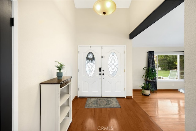 251 Miramar St, Upland, CA 91784 - entrance foyer with a high ceiling, wood finished floors, and baseboards