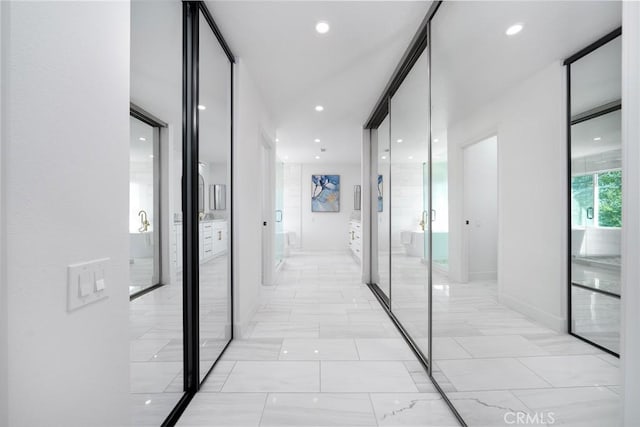 27591 Cenajo, Mission Viejo, CA 92691 - hall with light marble finish flooring, recessed lighting, and baseboards