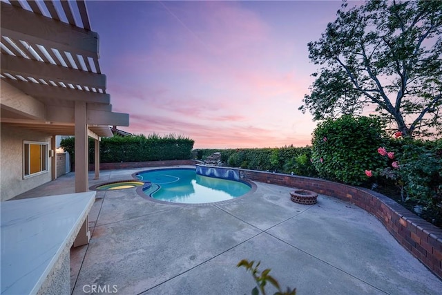 27591 Cenajo, Mission Viejo, CA 92691 - pool at dusk featuring an outdoor fire pit, a patio, and a pool with connected hot tub