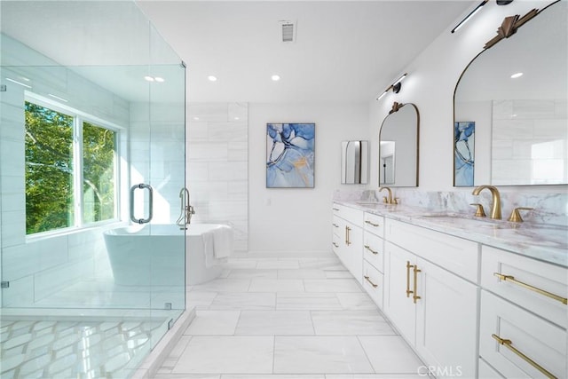 27591 Cenajo, Mission Viejo, CA 92691 - full bathroom featuring a freestanding tub, double vanity, a stall shower, recessed lighting, and baseboards