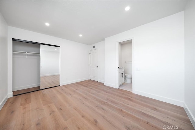 27591 Cenajo, Mission Viejo, CA 92691 - unfurnished bedroom with light wood-style flooring, baseboards, recessed lighting, a closet, and ensuite bathroom