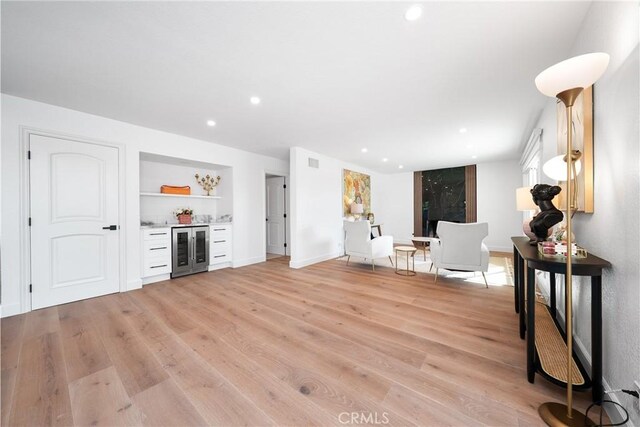 27591 Cenajo, Mission Viejo, CA 92691 - living area with beverage cooler, a dry bar, light wood-style floors, recessed lighting, and baseboards