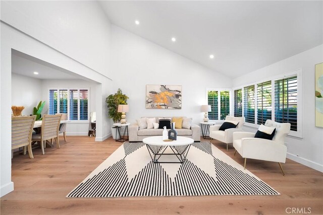 27591 Cenajo, Mission Viejo, CA 92691 - living area with high vaulted ceiling, healthy amount of natural light, light wood-type flooring, recessed lighting, and baseboards