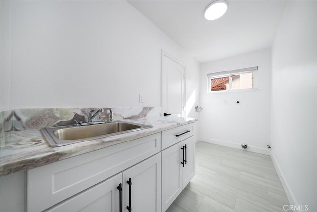 27591 Cenajo, Mission Viejo, CA 92691 - laundry area with electric dryer hookup, cabinet space, and baseboards