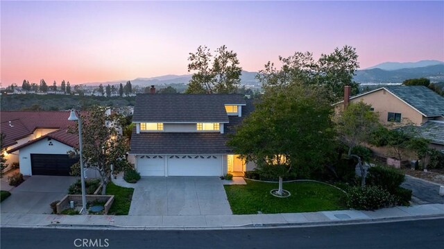 27591 Cenajo, Mission Viejo, CA 92691 - view of front of home featuring driveway, a mountain view, and an attached garage