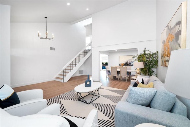 27591 Cenajo, Mission Viejo, CA 92691 - living area with stairs, wood finished floors, a chandelier, recessed lighting, and a high ceiling