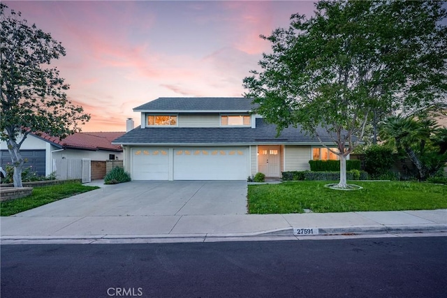 27591 Cenajo, Mission Viejo, CA 92691 - traditional home featuring driveway, an attached garage, and a yard