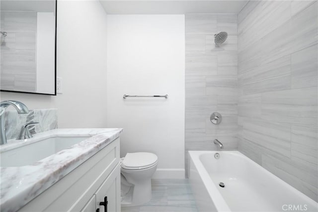 27591 Cenajo, Mission Viejo, CA 92691 - bathroom featuring vanity, toilet, marble look tiles, baseboards, and washtub / shower combination