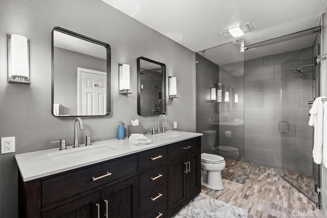 27833 Hamiltair Dr, Lake Arrowhead, CA 92352 - bathroom featuring toilet, double vanity, and a shower stall
