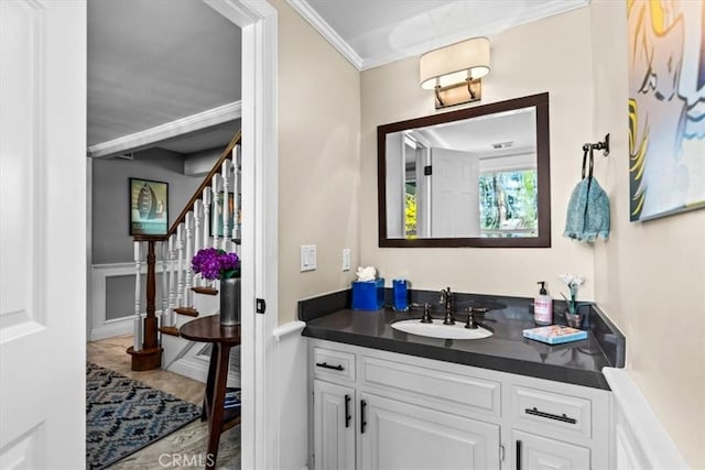 27833 Hamiltair Dr, Lake Arrowhead, CA 92352 - bathroom with vanity, ornamental molding, and a wainscoted wall