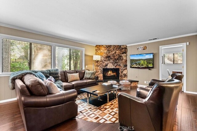 27833 Hamiltair Dr, Lake Arrowhead, CA 92352 - living room with ornamental molding, dark wood finished floors, and a stone fireplace