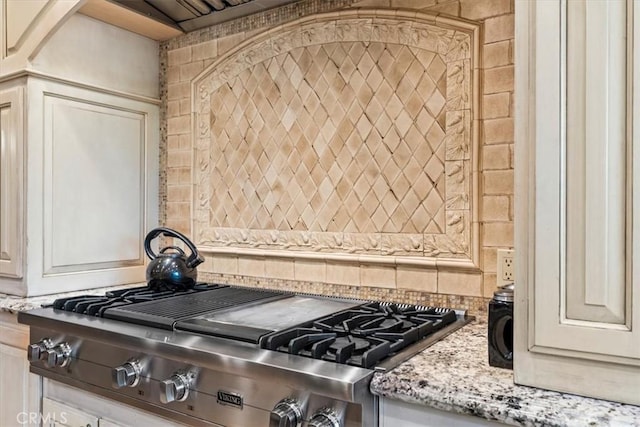 27833 Hamiltair Dr, Lake Arrowhead, CA 92352 - kitchen view of luxury stove, light stone countertops, and backsplash