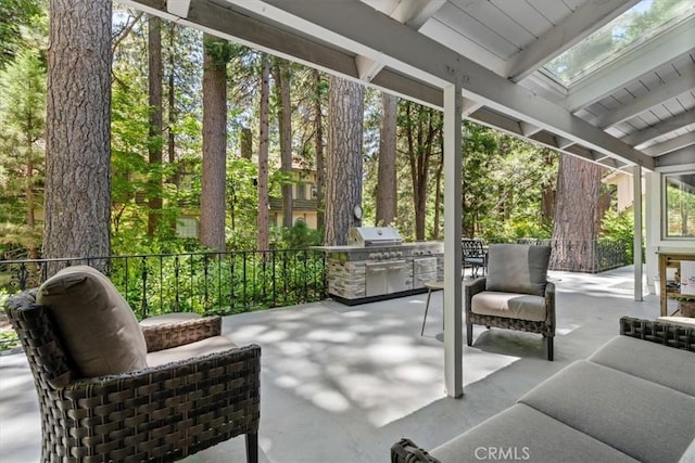 27833 Hamiltair Dr, Lake Arrowhead, CA 92352 - sunroom / solarium featuring a skylight, beamed ceiling, and area for grilling