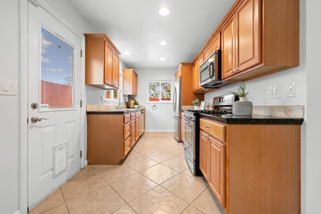 1409 Taft St, Escondido, CA 92026 - kitchen featuring stainless steel appliances, a sink, recessed lighting, baseboards, and light tile patterned flooring